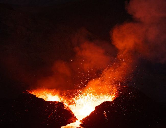 Flowing lava energy shapes in a dark room